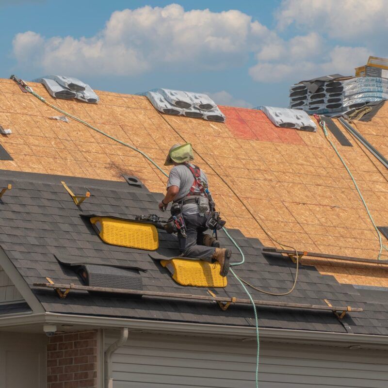 Roof workers installing a new roof
